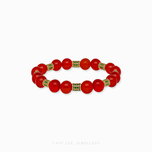 Close-up of 999 Pure Gold Mixed Enamel with Red Agate Bracelet featuring gold links, enamel accents, and red agate beads on display.