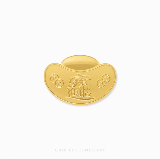 Gold ingot with Chinese characters on a white background