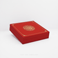 Red jewelry box with gold emblem on a white background