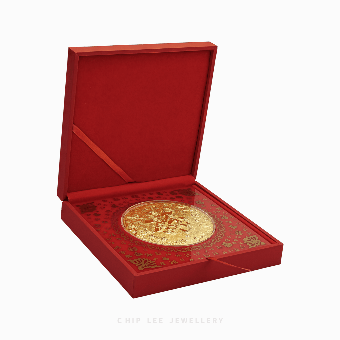 Gold medallion with intricate designs on a white background