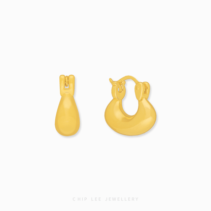 Chip Lee Jewellery Singapore Puffy Crescent Hoop Earrings 999 Gold. Thick gold hoops for women. High-shine, comfortable, everyday luxury.