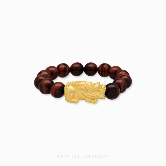 Close-up of 999 Pure Gold Red Tiger Eye Pixiu Bracelet featuring red tiger eye beads and gleaming golden Pixiu charm