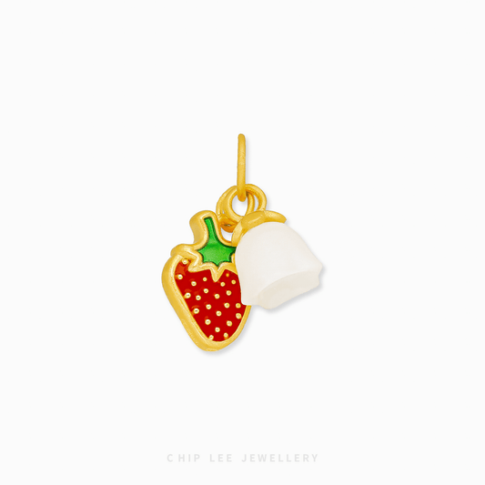 Gold charm with strawberry and floral design on a white background