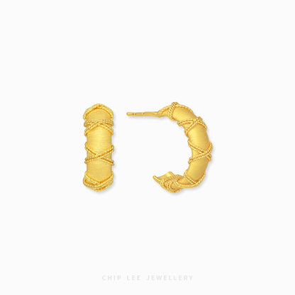 A pair of gold hoop earrings with a textured, wrapped design, displayed on a clean white background with the brand name 'CHIP LEE JEWELLERY' printed at the bottom.