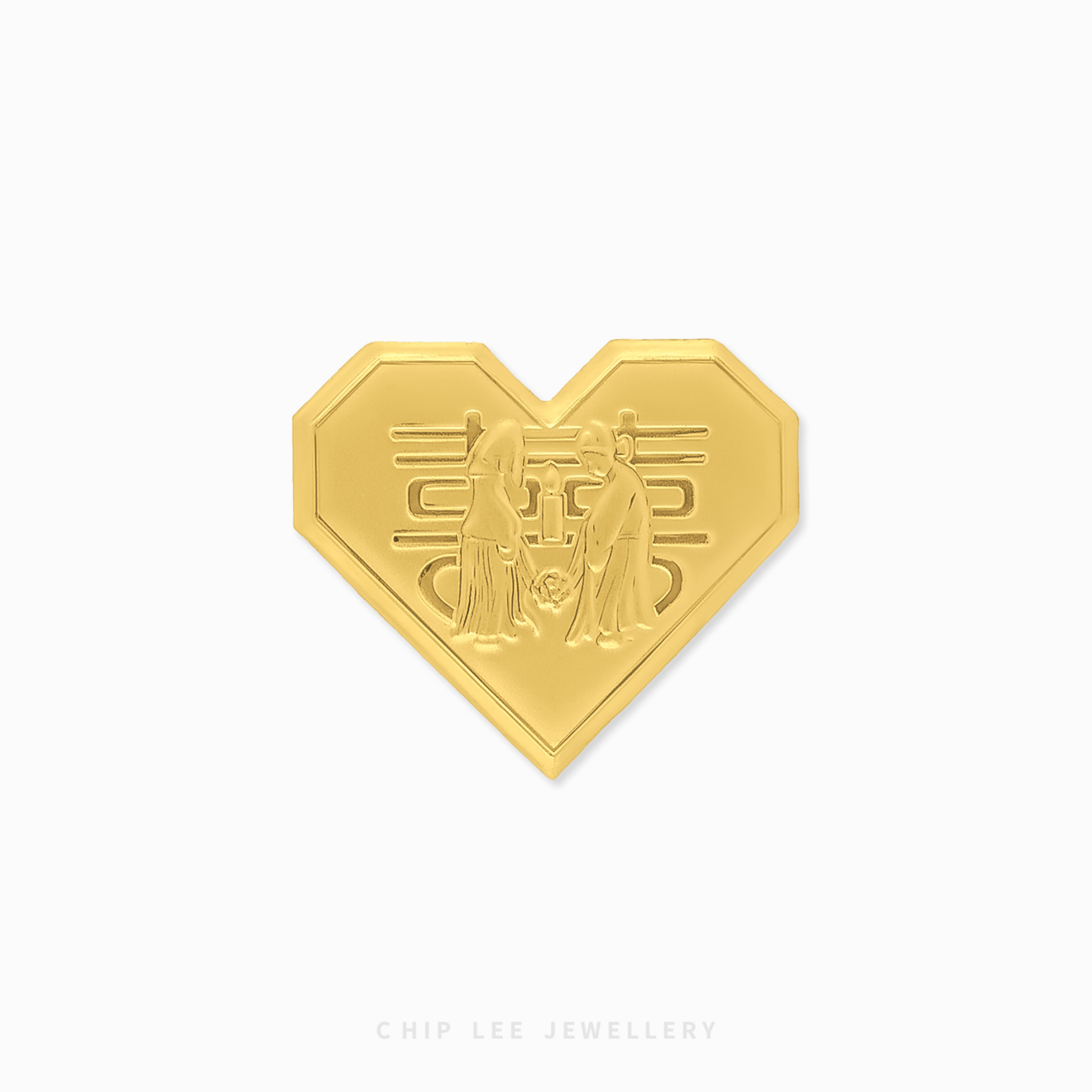 Gold heart ornament with intricate design on a white background