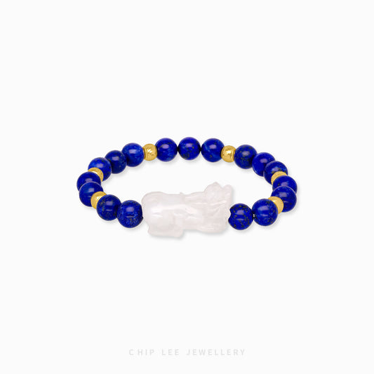 Close-up of 999 Pure Gold White Jade Pixiu with Blue Agate Bracelet featuring white jade and blue agate beads with gold Pixiu charm on display.