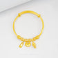 Abundance & Prosperity Baby Bangle in 916 gold symbolizing growth, luck, and elegance for newborns and toddlers.