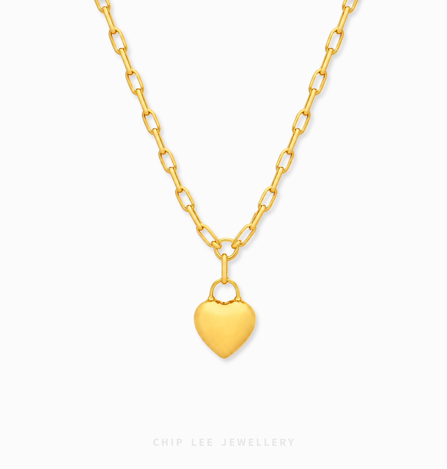 A gold heart pendant necklace on a matching gold chain, shown against a plain white background with a faint 'CHIP LEE JEWELLERY' watermark at the bottom.