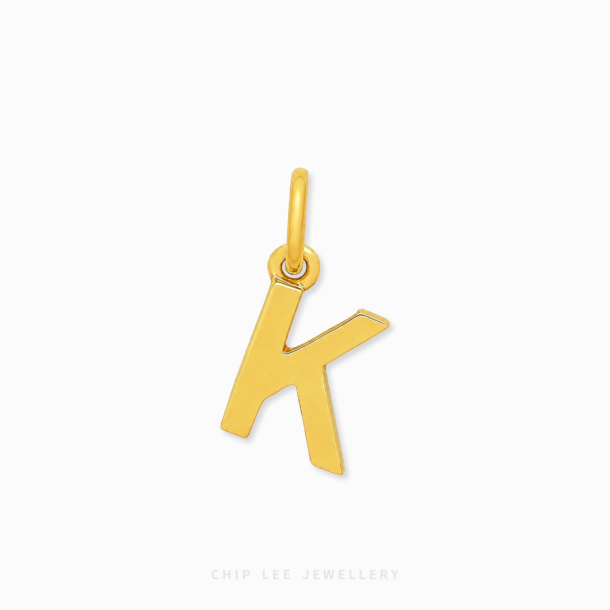 A polished gold initial pendant charm shaped like the letter 'K', shown on a clean white background with a subtle shadow.