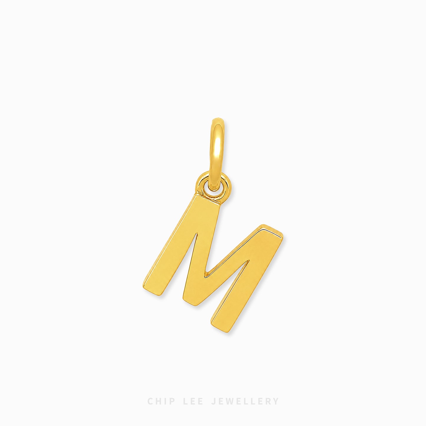A polished yellow gold initial pendant charm shaped like the letter 'M', shown on a clean white background with a subtle shadow.