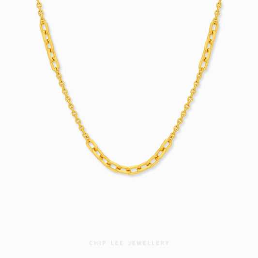 Amara Necklace featuring alternating elongated rectangular links and delicate oval chain links in a graceful curved design.