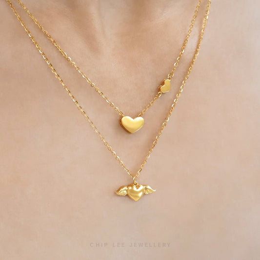 Shop the graceful Angel Wings Heart Necklace from Chip Lee Jewellery Singapore. This certified 916 Gold (22K) piece features a beautiful heart pendant with angelic wings, symbolising love and protection.