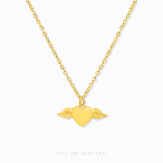 Chip Lee Angel Wings Heart Necklace. Certified 916 Gold (22K) pendant with intricate angel wings embracing a heart. Elegant love jewellery from Chip Lee SG.