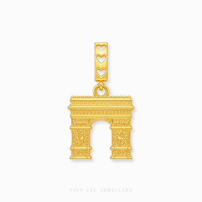 A gold-toned Arc de Triomphe charm with three heart-shaped cutouts on the bail, shown on a light gray background with Chip Lee Jewellery branding at the bottom.