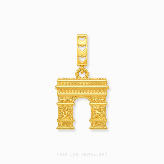 A gold-toned Arc de Triomphe charm with three heart-shaped cutouts on the bail, shown on a light gray background with Chip Lee Jewellery branding at the bottom.