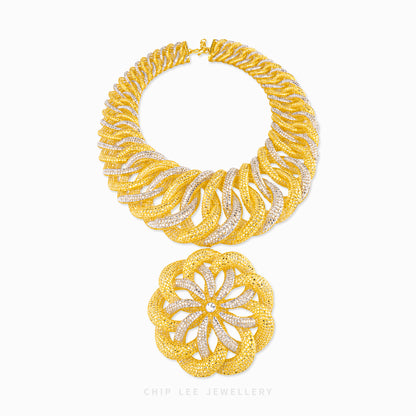A gold and silver pavé necklace set by Chip Lee Jewellery, featuring a wide collar-style necklace and a matching round pendant, displayed on a clean white background.