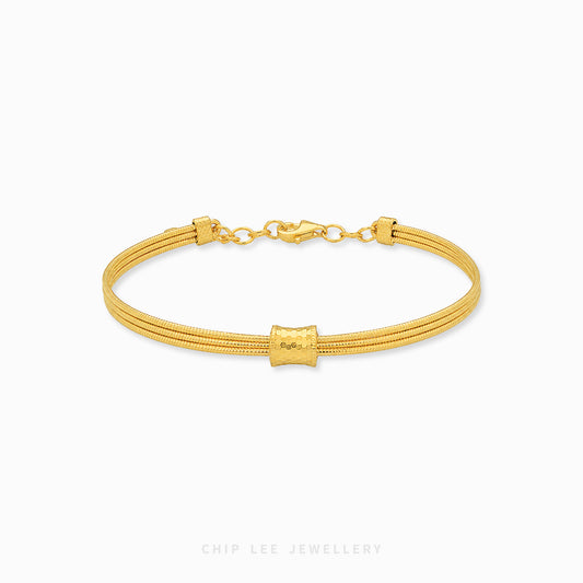 999 gold barrel triple rope bracelet in 24K pure gold with structured barrel centerpiece
