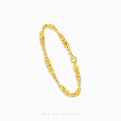 A gold multi-strand beaded chain bracelet with a lobster clasp, displayed on a clean white background with the brand name 'CHIP LEE JEWELLERY' printed at the bottom.