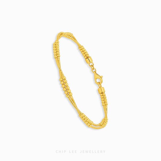 A gold multi-strand beaded chain bracelet with a lobster clasp, displayed on a clean white background with the brand name 'CHIP LEE JEWELLERY' printed at the bottom.