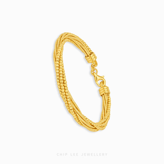 A gold multi-strand beaded bracelet with a lobster clasp, displayed on a clean white background with the brand name 'CHIP LEE JEWELLERY' printed at the bottom.