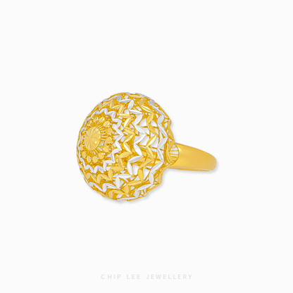 Bold Oracle Ring with intricate detailing, polished gold textures, and a striking, contemporary design for women.