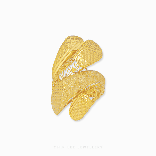 Bold Swoosh Ring with sleek swooping design, polished gold finish, contemporary elegance for modern women.