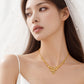A close-up of a woman wearing a delicate gold necklace with a heart-shaped pendant, styled with a white bridal veil and white spaghetti-strap top. The brand name 'CHIP LEE JEWELLERY' is subtly printed at the bottom.