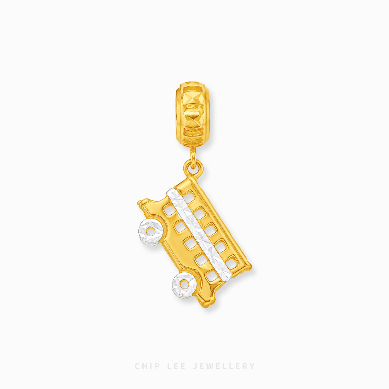 A gold school bus charm pendant with white textured accents, shown on a clean white background with a brand watermark at the bottom.