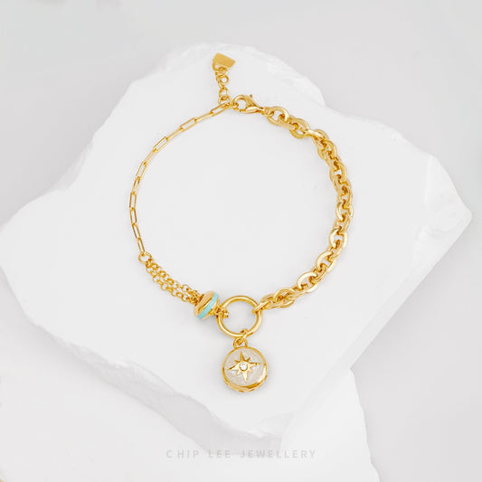 Celestial Compass Bracelet in solid 916 gold, featuring a compass charm, hallmarked for certified purity and everyday elegance.