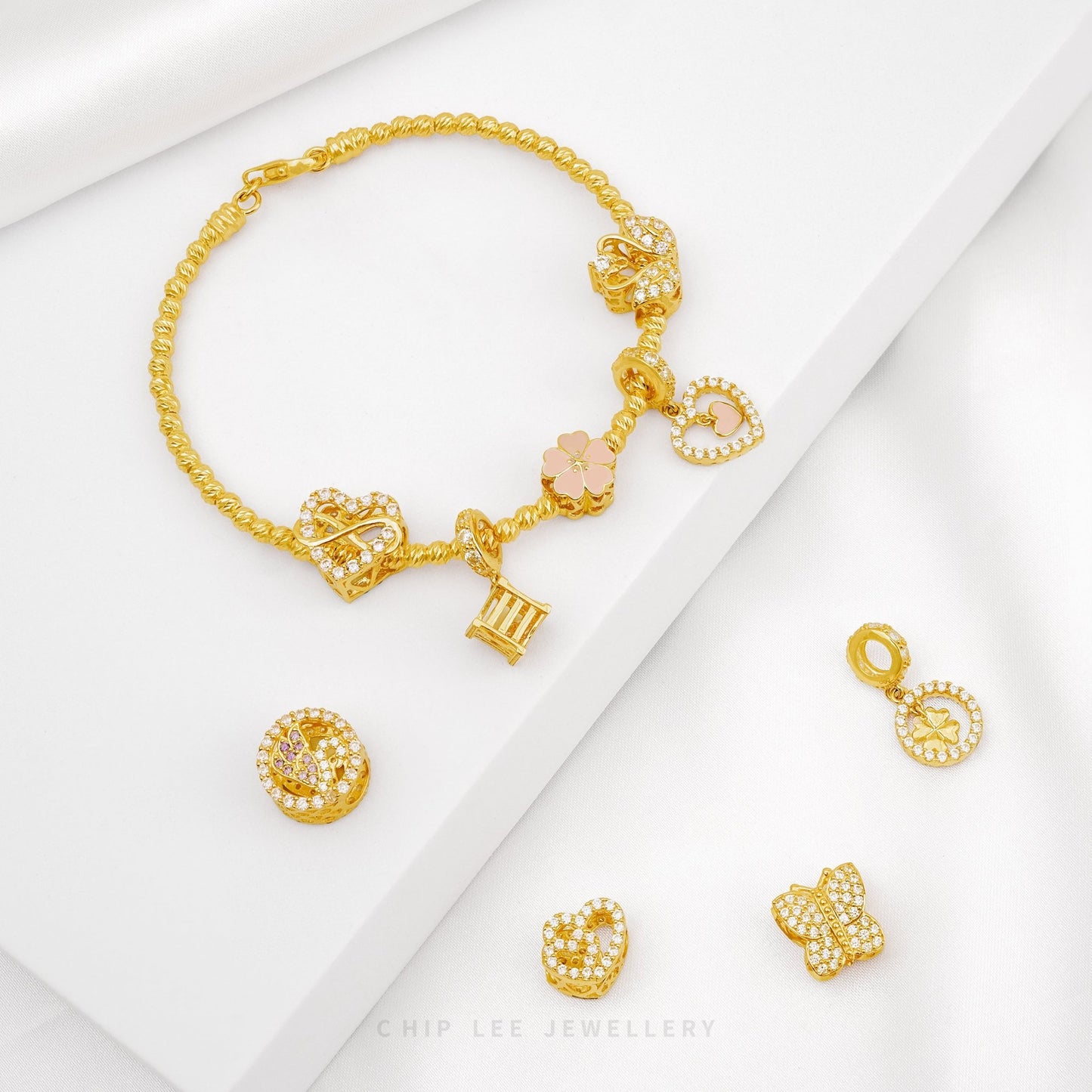 Gold bracelet and earrings set on a white background with 'Chop Lee Jewellery' branding.
