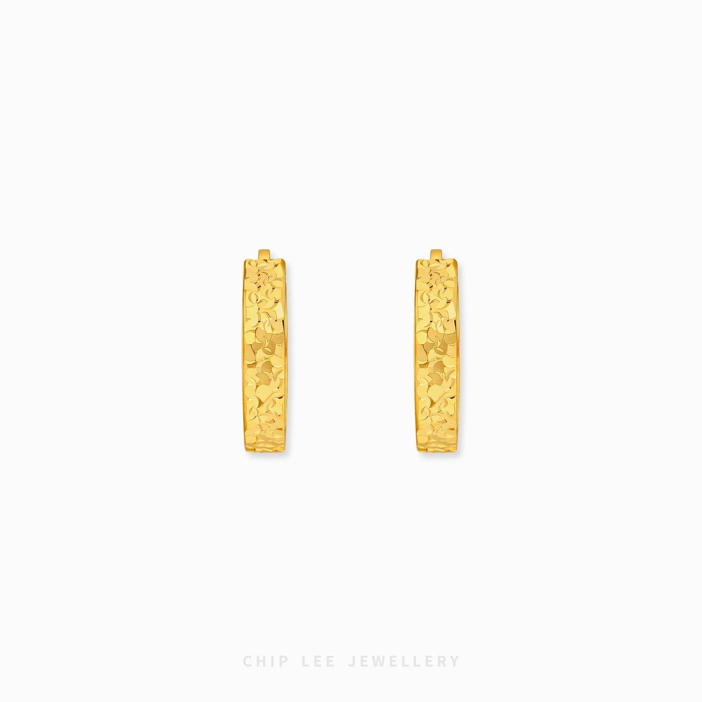 Chiseled hoop earrings with textured gold finish