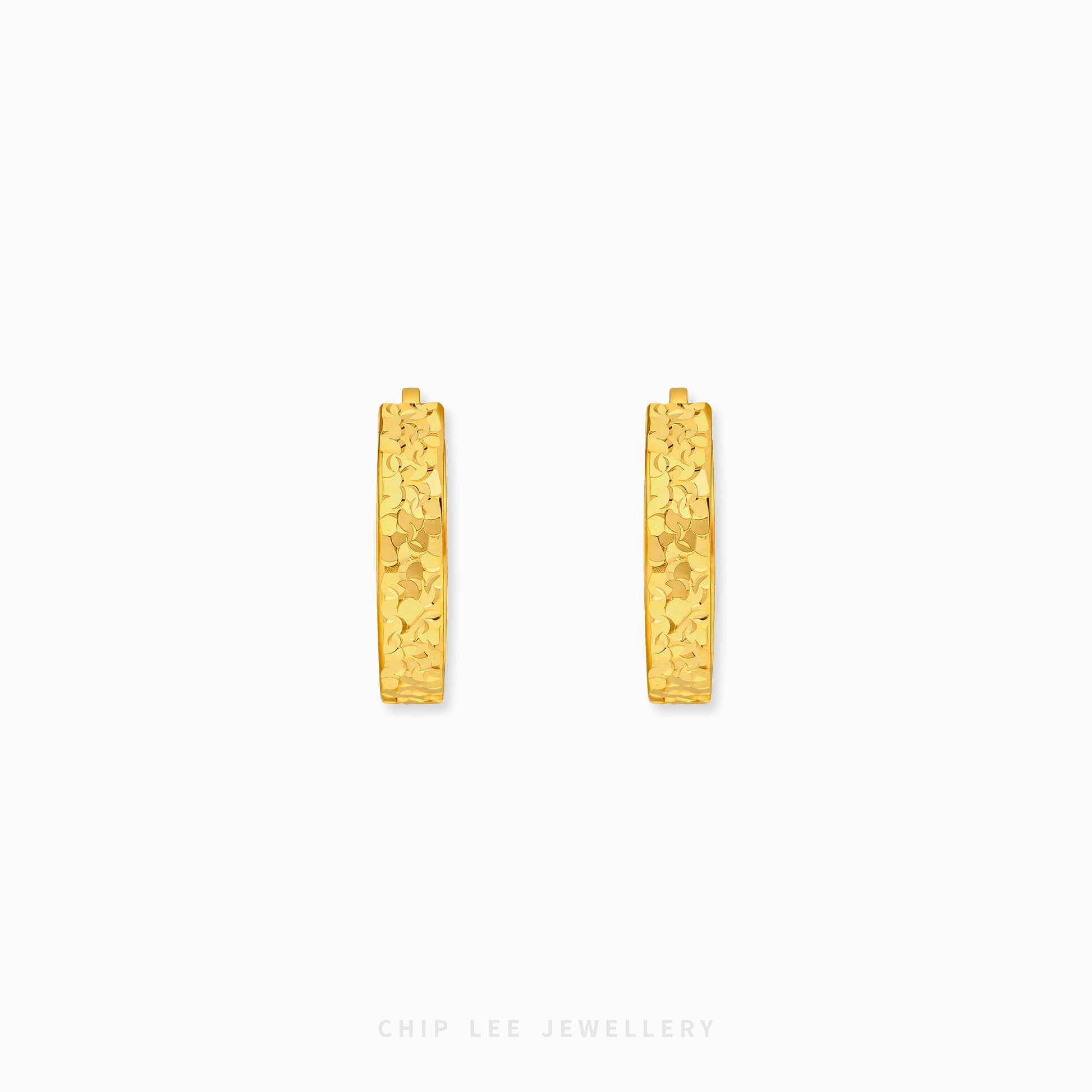 Chiseled hoop earrings with textured gold finish