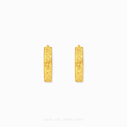 Chiseled hoop earrings with textured gold finish