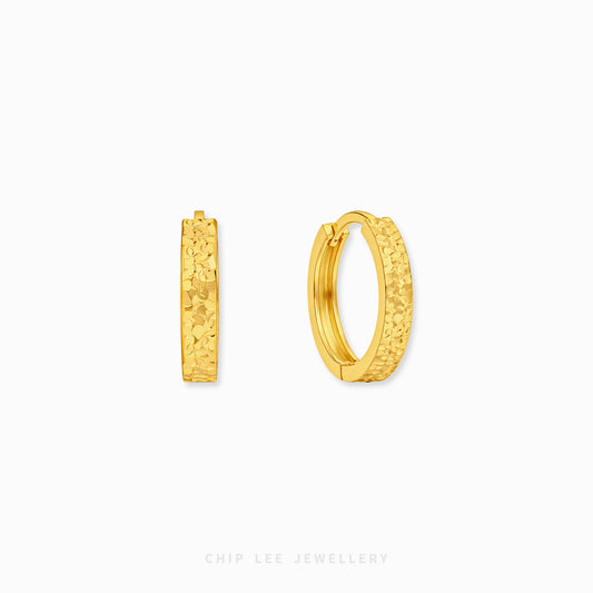 Chiseled hoop earrings with textured gold finish