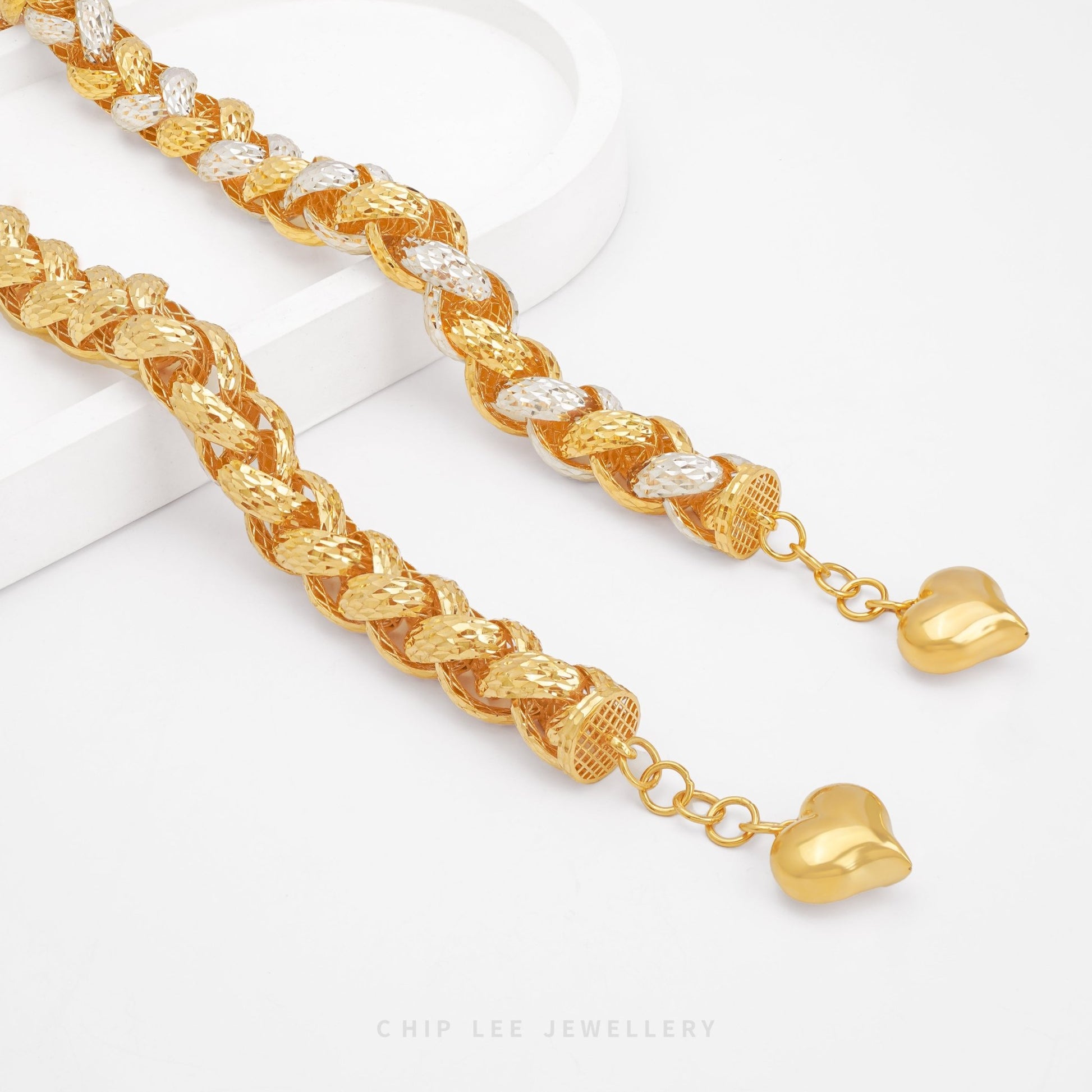 Discover the Chunky Heart Charm Bracelet by Chip Lee Jewellery – certified 916 gold, bold link design with heart charms, crafted in Singapore for modern luxe.