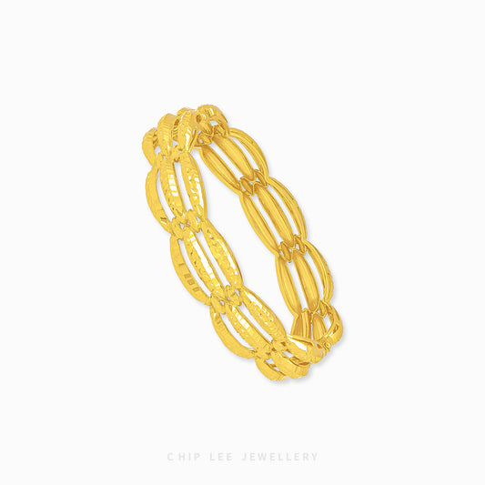 Chunky Trinity Bangle by Chip Lee Jewellery Singapore, 916/22K gold, three-tone intertwined design, symbolizes unity and strength, bold statement piece.