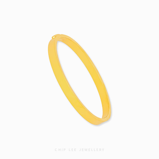 Classic Bangle by Chip Lee Jewellery Singapore, 916/22K gold, sleek minimalist design, versatile accessory for daily wear or gifting.