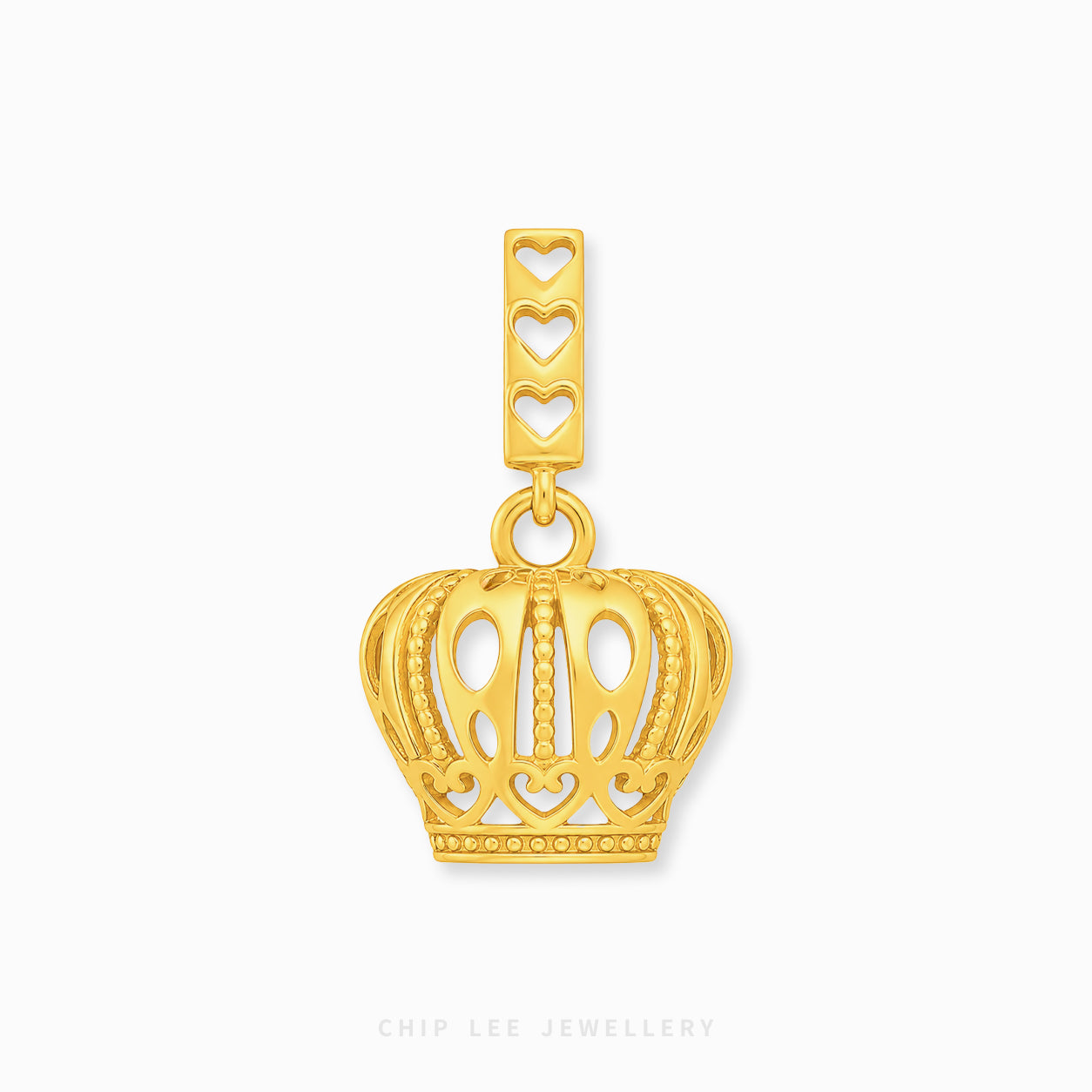 A gold crown-shaped pendant charm with a rectangular top bar featuring three heart cutouts, shown on a clean white background with a faint Chip Lee Jewellery watermark at the bottom.
