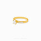 A yellow gold solitaire ring with a round-cut clear center stone and a row of small pavé-set clear stones on the band, shown on a plain white background. The brand name 'CHIP LEE JEWELLERY' is faintly visible at the bottom.