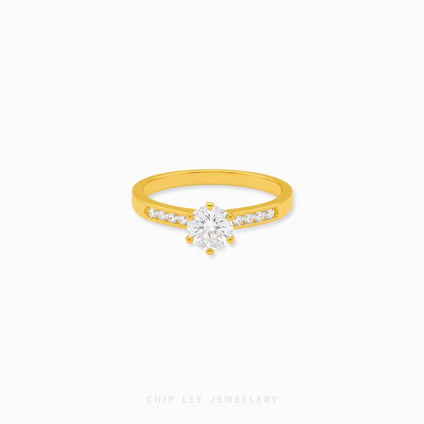 Cubic Zirconia pavé solitaire ring featuring a brilliant round-cut centre stone with sparkling shoulder-set stones on a polished gold band.