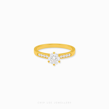 Cubic Zirconia pavé solitaire ring featuring a brilliant round-cut centre stone with sparkling shoulder-set stones on a polished gold band.