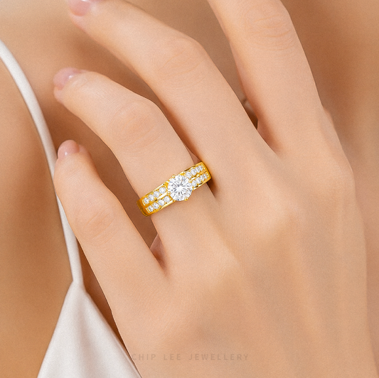 Cubic Zirconia Regal Ring featuring a brilliant round-cut centre stone with a split pavé band on a polished gold ring.