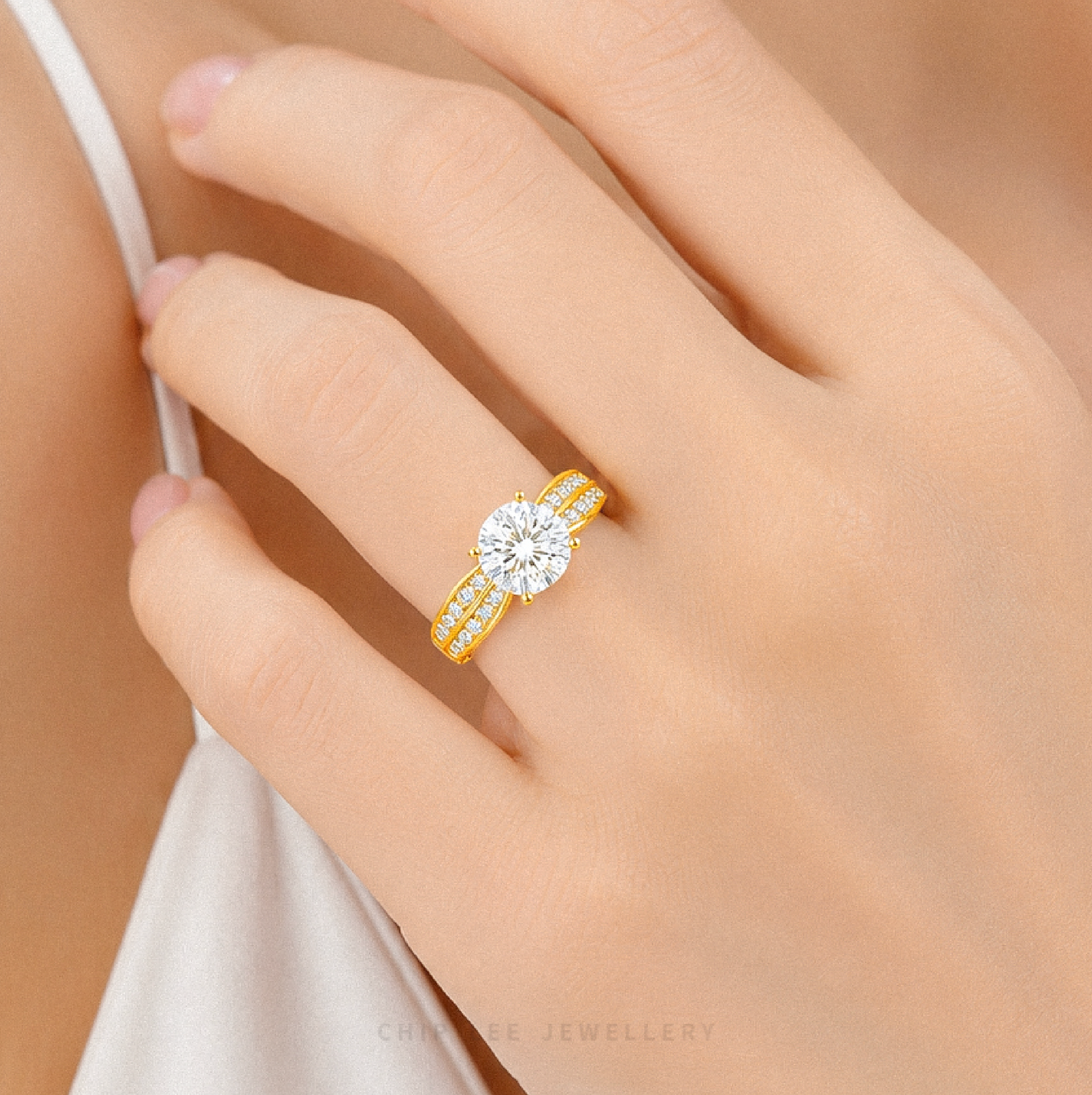 Cubic Zirconia Regal Ring featuring a brilliant round-cut centre stone with a split pavé band on a polished gold ring.