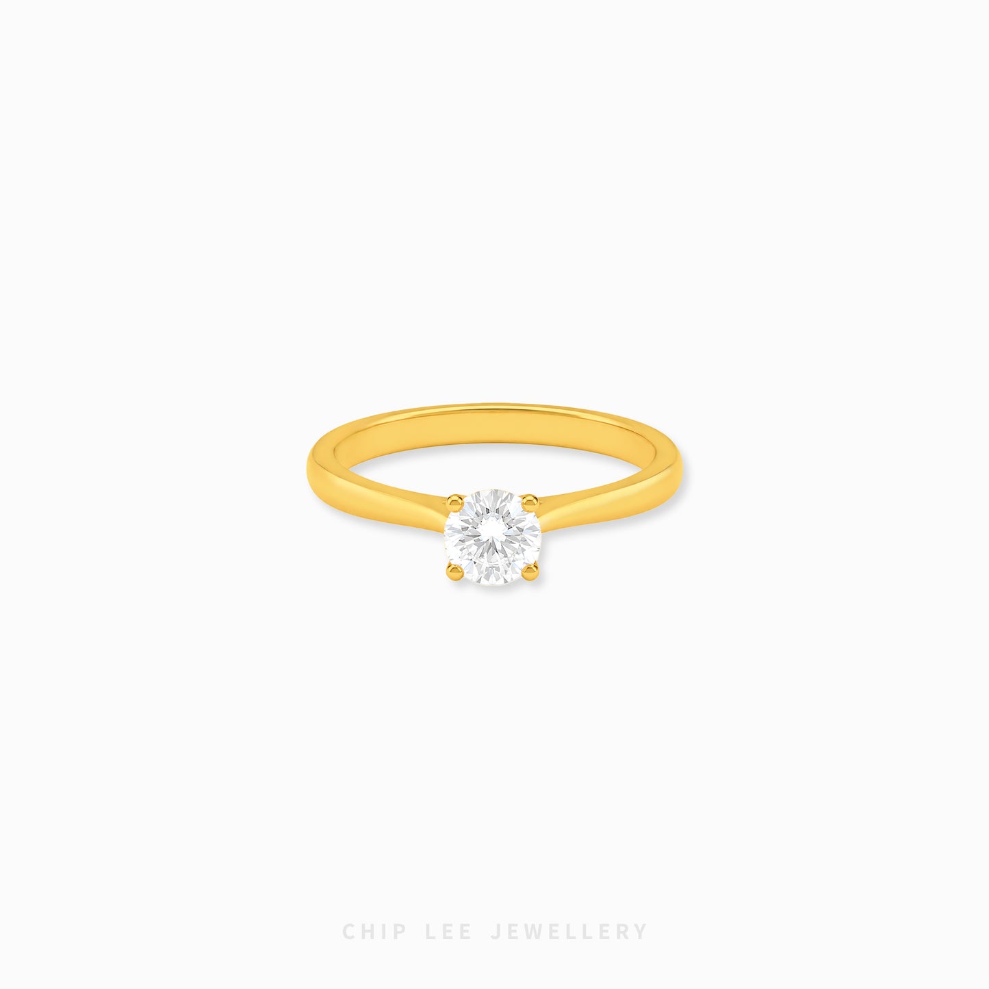 999 Gold Cubic Zirconia Solitaire Ring featuring a brilliant round-cut cubic zirconia on a polished yellow gold band.