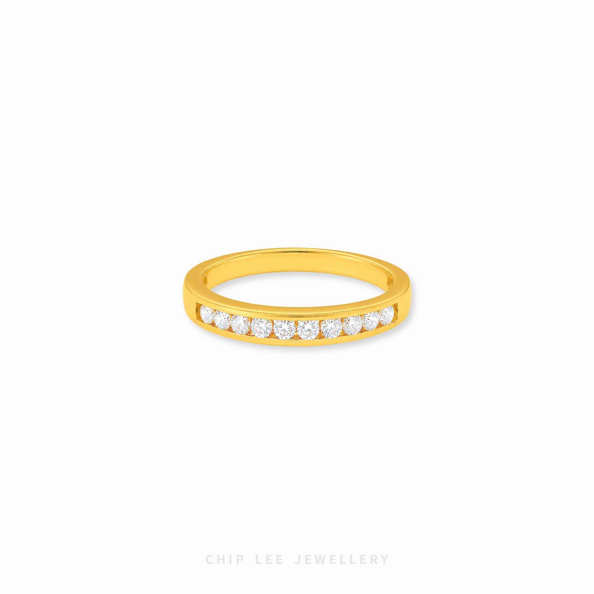 Gold half eternity ring featuring brilliant round-cut cubic zirconia stones in a polished minimalist setting.