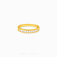 Gold half eternity ring featuring brilliant round-cut cubic zirconia stones in a polished minimalist setting.