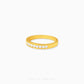 Gold half eternity ring featuring brilliant round-cut cubic zirconia stones in a polished minimalist setting.