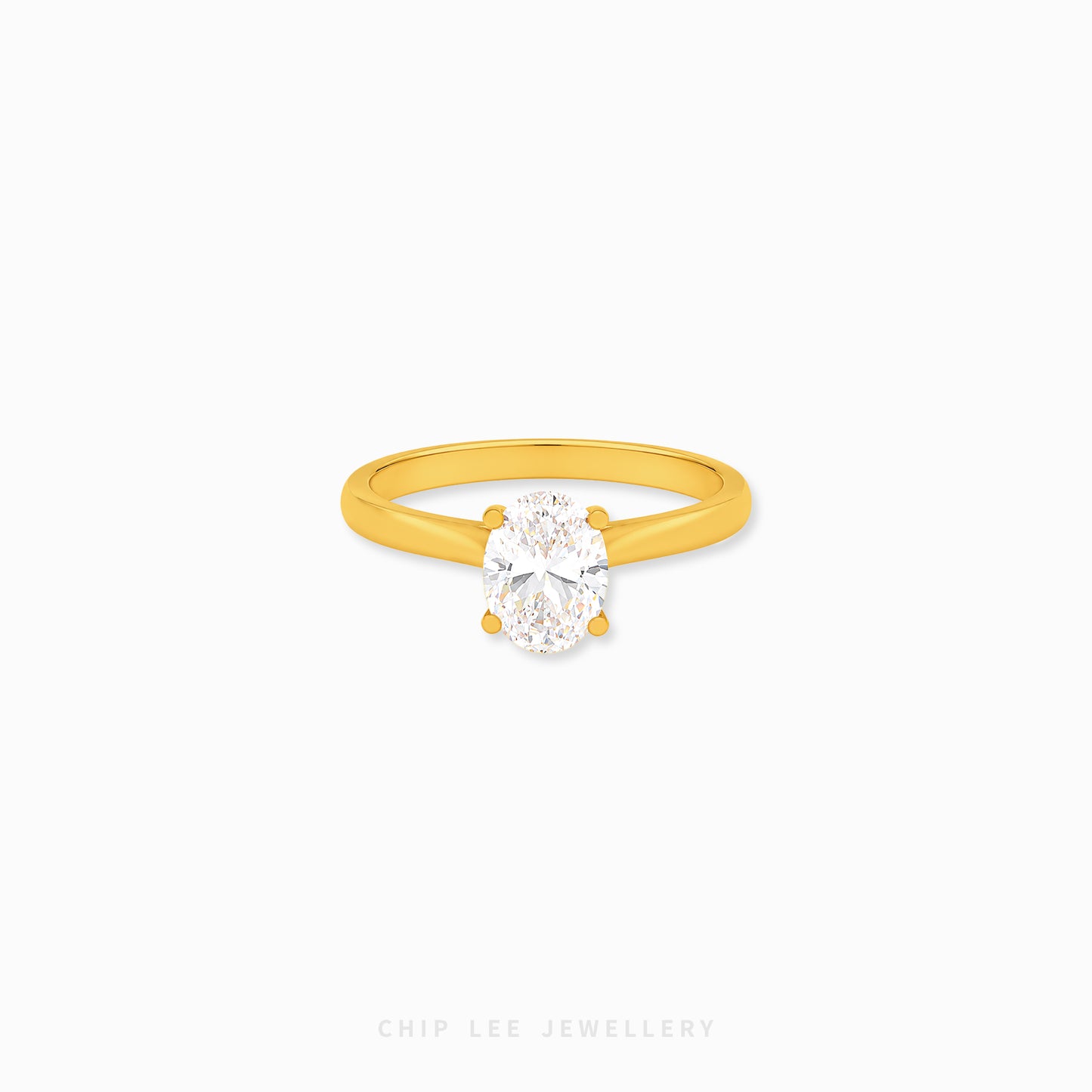 Oval Cubic Zirconia Solitaire Ring with a brilliant oval-cut stone on a polished gold band.