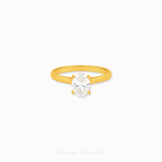 Oval Cubic Zirconia Solitaire Ring with a brilliant oval-cut stone on a polished gold band.