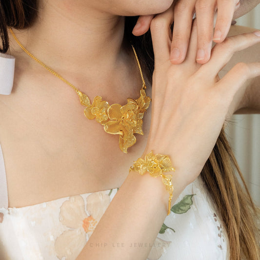 999 24K Gold Flora Necklace featuring delicate floral details in pure gold, designed for timeless elegance and effortless daily sophistication.